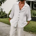 Detail of men's white long sleeve cotton linen beach shirt with wooden buttons - S / Tops / White