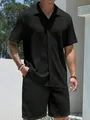 Close-up of a men's black textured waffle knit short sleeve shirt and shorts summer set - M / Top And Bottom / Black