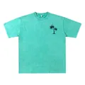 T-shirt vintage lavé pour hommes en vert sarcelle avec petit imprimé graphique de palmier. - Vert