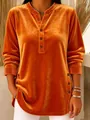 Close-up of orange velvet V-neck top with decorative button details on front and sides. - S / Tops / Orange