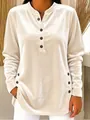Detailed view of women's golden velvet long-sleeve top featuring decorative buttons - Apricot