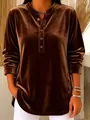 Detailed close-up view of brown gold velvet long-sleeved top with stylish buttons and texture - Brown