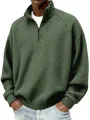 Gros plan d'un sweat-shirt vert foncé à texture gaufrée avec col montant à glissière - S / Hauts / Vert Militaire