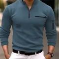 Vista dettagliata della polo sportiva da uomo con zip a un quarto e tasca sulla manica - Taglia S / Top / Azzurro