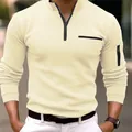 Close-up detail of cream men's quarter-zip long sleeve polo shirt with arm zipper. - Apricot