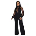 Schwarzer Mesh-Spitzen-Jumpsuit mit weitem Bein an einem Model in der Vollansicht. - S / Oberteil und Hose / Schwarz