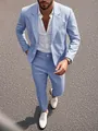 Close-up view of a light blue tailored men's suit worn by model on city asphalt road - S / Top And Bottom / Blue