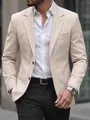 Detalle de alta calidad de un blazer beige entallado para hombre para negocios y fiestas - S / Tops / Albaricoque