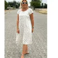 Detail view of a bohemian round neck midi dress featuring a stylish beige abstract animal print - S / Top And Bottom / Apricot