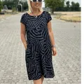 Full-body view of a bohemian leopard print plus size summer dress on a model outdoors. - S / Top And Bottom / Black