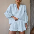 Stylish light blue linen two-piece set with lantern sleeve top and ruffled shorts - S / Top And Bottom / Light Blue