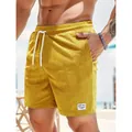 Hochwertige gelbe Cord-Shorts für Herren mit weißem Kordelzug und Logo-Aufnäher. - S / Unterteile / Gelb