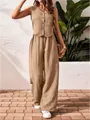 Full body view of a khaki linen vest and wide-leg trousers set in a summer setting - Khaki