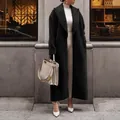 Elegante zwarte wollen jas met lange mouwen en revers voor herfst en winter straatmode - S / Tops / Zwart