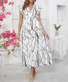 Elegant V-neck ruffled maxi dress with black abstract print design for a stylish summer look - S / White