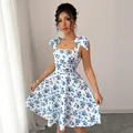 Elegant summer women's blue and white floral tie-strap dress with flared A-line skirt silhouette - S / Spaghetti Strap Dress / Blue