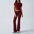 Burgundy two-piece yoga set featuring a slim fit crew neck crop top and flared leggings - Burgundy