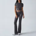 Detailed view of the charcoal grey two-piece activewear set with crop top and flared pants - Dark Gray