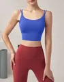 Close-up of a blue quick-dry sports bra with thin double straps on a female model - S / Tops / Blue