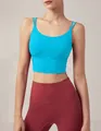 Detailed view of a bright blue cross-back sports bra with thin double straps - Cyan