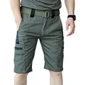 Detail view of olive green tactical cargo shorts with durable multi-pockets design. - S / Bottoms / Green