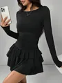 Detail of black long-sleeved dress featuring waist ruching and ruffled hem. - XS / Black