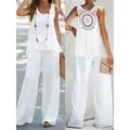 Detailed view of white sleeveless top and wide-leg pants set with crochet back - White