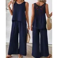 Elegant navy blue sleeveless two-piece set featuring a crochet back and wide-leg pants - Navy Blue