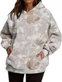 Detailed view of oversized women's hoodie with maple leaf camouflage and front pocket - S / Tops / Cloud Flower
