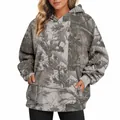 Close-up of women's oversized camouflage hoodie with maple leaf print and front pocket - S / Tops / Pattern 17