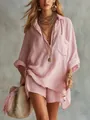 Close-up detail of a pink cotton linen summer shirt and shorts beach set on model - Pink