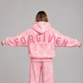 Detailed back view of pink marble print hoodie featuring 'FORGIVEN' text print. - Pink