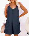 Close-up of women's waffle knit sleeveless romper with button front and side pockets - S / Navy Blue