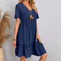 Detailed view of a navy blue short-sleeved tiered dress with crinkled texture and V-neckline - S / Tops / Navy Blue (67#)