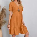 Detailed view of casual orange V-neck short-sleeved mini dress with ruffled hem - S / Top And Bottom / Orange