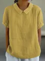 Detailed view of yellow cotton linen blouse with Peter Pan collar and textured fabric - Yellow