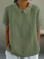Front view of a loose green short-sleeve cotton blouse with a minimalist lapel collar - S / Tops / Olive Green