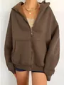Detailed view of a brown oversized women's zip-up hoodie with large front pockets - S / Tops / Dark Brown