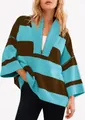Close-up of oversized striped half-zip sweatshirt with a relaxed drop-shoulder fit. - Blue Brown Stripes