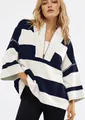 Close-up of oversized navy and cream striped half-zip sweatshirt on model - Navy Blue and White