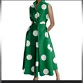 Sleeveless green dress featuring bold white polka dots and a stylish flared swing skirt - XS / Dresses / Green with Large White Dots
