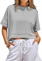 Detailed view of a casual gray oversized crop top featuring a chest pocket and raw hem - S / Tops / Gray