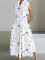 Detail view of a white sleeveless V-neck floral dress with button-front and side pockets - XS / Dresses / White Flower