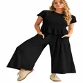 Detail of black two-piece set with ruffled top and wide leg trousers for women - S / Top And Bottom / Black