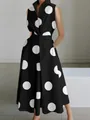 Detail view of sleeveless black dress with large white polka dots and V-neckline - XS / Dresses / Black with Large White Polka Dots