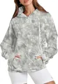 Detail view of a women's oversized hoodie with a gray camouflage pattern and pouch pocket. - Grey Branches