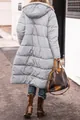 Back view of a long light grey hooded puffer coat featuring a warm quilted design for women - S / Tops / Light Gray