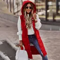 Close-up of a women's red hooded mid-length padded vest styled for autumn - Red