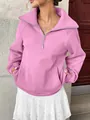Vista dettagliata della felpa in pile rosa da donna con mezza zip e ampia tasca - Taglia S / Top / Rosa