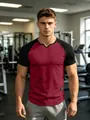 Men's slim fit raglan sleeve sports t-shirt in a gym setting with stylish v-neck detail. - S / Tops / Red Black Contrast